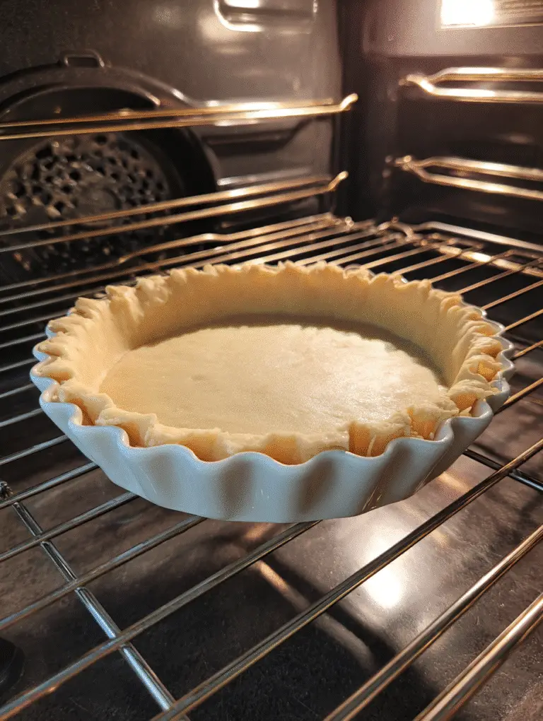 Pie Crust Recipe – Flaky, Buttery, Foolproof Every Time 3 Pie crust with parchment and weights for blind baking